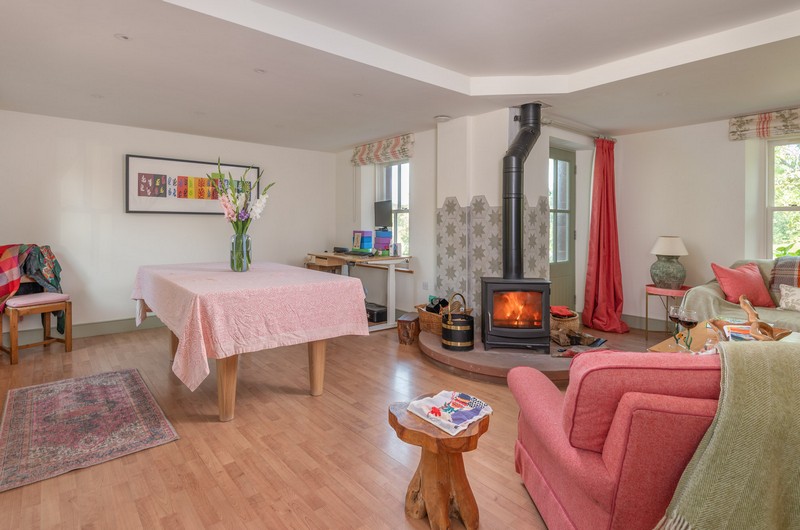Living are in the holiday cottage with a woodburner blazing